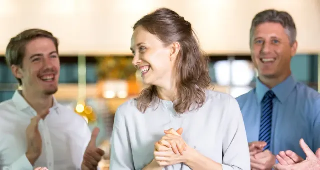 Group of business people laughing together at a networking event