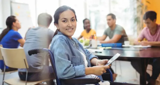 Team members working together in a collaborative workspace