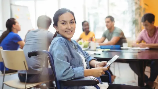 Team members working together in a collaborative workspace